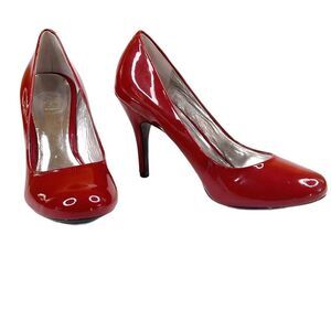 Jessica Simpson burnt red patent size 7.5B round toe pumps with 3 3/4” heels.